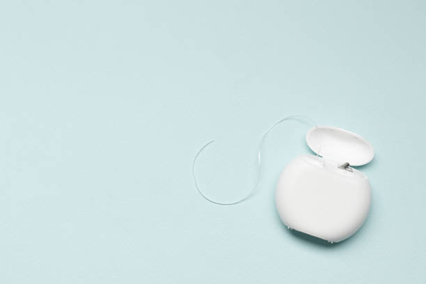 istock Dental floss on a blue background. Place for text. Dental care 1844591612