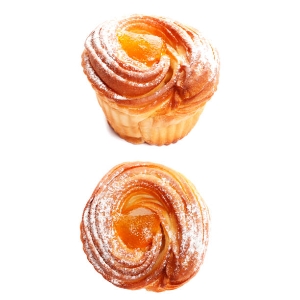 Sweet hot peach jam muffins isolated on white background