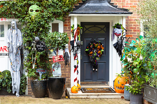London, UK - 31 October, 2023: A Halloween display, including all kinds of seasonal halloween decorations, outside the front of a house in London, UK.