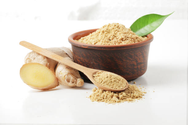 istock Dry and fresh ginger in bowl isolated on white background 1844641561