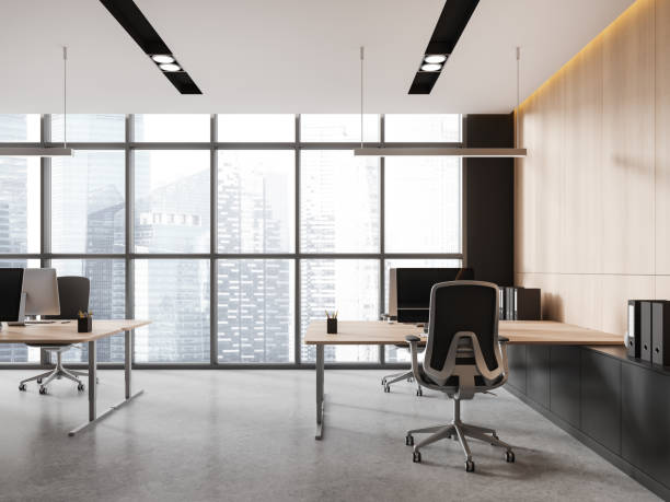 istock Stylish business interior with armchairs and table, pc monitors and drawer 1844651548