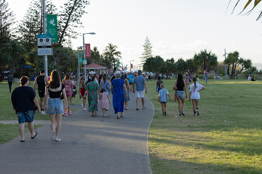 Coolangatta, Australia. 10th December 2023. Crowds arrive at the Cooly Carols Christmas festivities in Queen Elizabeth Park, Marine Parade
