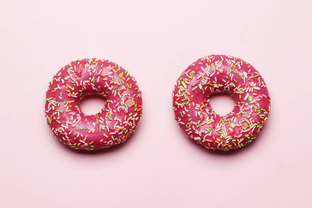 istock Sweet donuts on a pink background. Place for text 1844674064