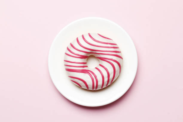 istock Sweet donuts on a pink background. Place for text 1844674592