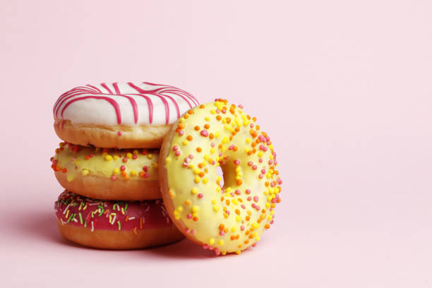 istock Sweet donuts on a pink background. Place for text 1844676668