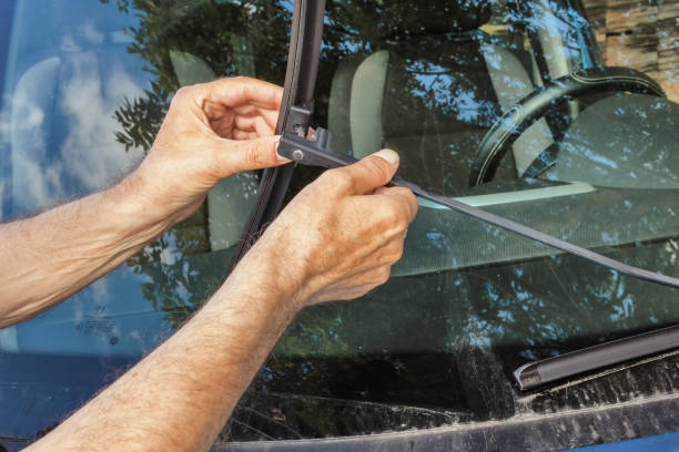 istock the man replaces the wiper 1844681463