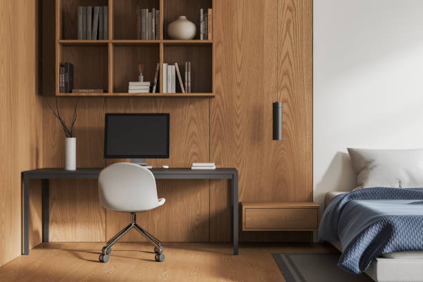 istock White and wooden bedroom interior with workplace 1844695724