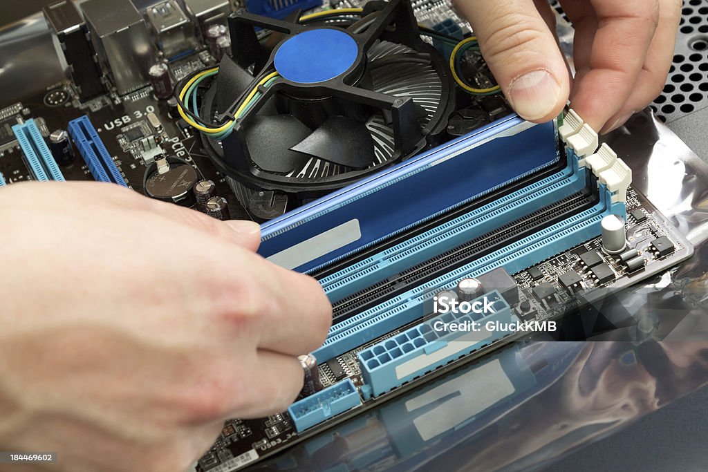 Installing random access memory into PC CPU Stock Photo