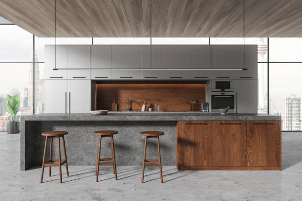 istock Panoramic gray kitchen interior with cabinets and island 1844698897
