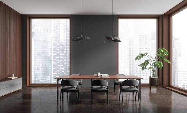 istock Dark living room interior with table and seats, drawer and panoramic window 1844700954