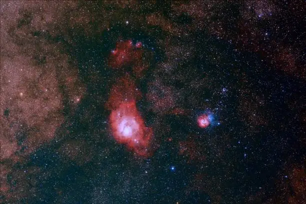 Messier 8 Lagoon Nebula and Messier 20 Trifid Nebula in the constellation Sagittarius.