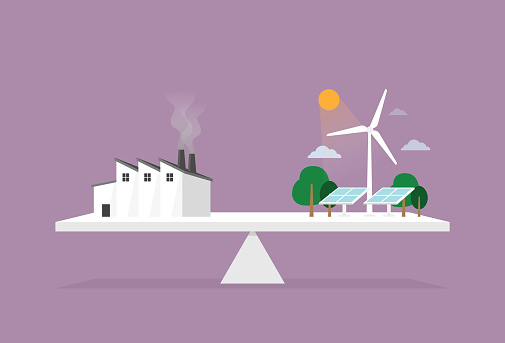 factory, solar panel, and wind turbine on a scale for sustainable energy concept