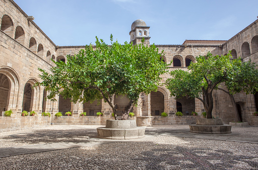 Alcantara, Spain - Oct 6th, 2022: Gothic Cloister of Convent of San Benito de Alcantara, Caceres, Spain. Courtyard