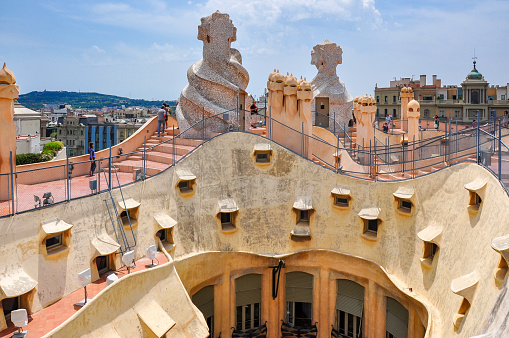 Barcelona, Spain - July 2018: Sculptures on roof of La Pedrera (Casa Mila) house in Barcelona