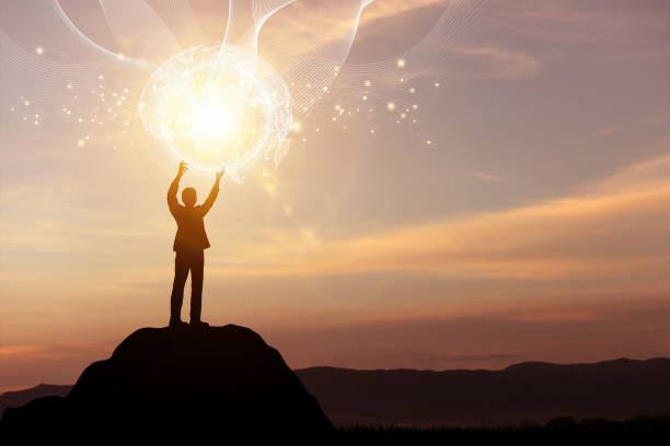 istock Silhouette man on top mountain with virtual world. Concept of global network connection 1844757404