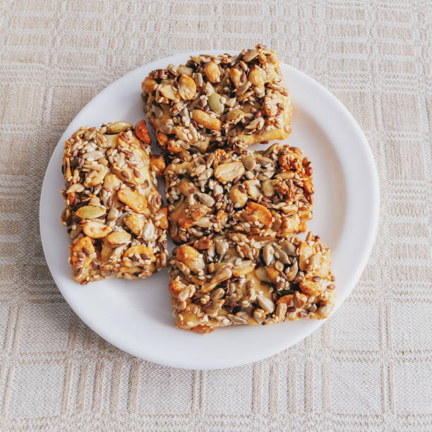 istock Biscuits with nuts and seeds in a plate on a tablecloth 1844789559