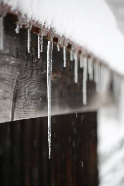 istock Icicles hang from the cornice of the stable. 1844793663