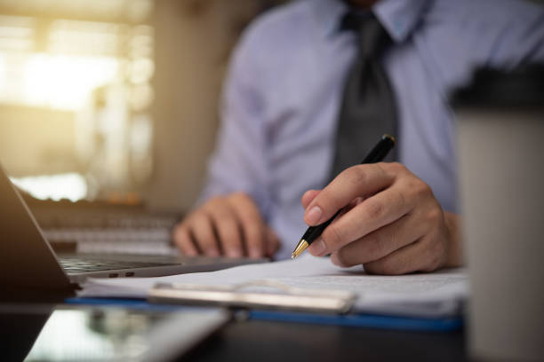 istock man hands with pen writing on notebook in the office.learning, education and work.writes goals, plans, make to do and wish list on desk.. 1844793678