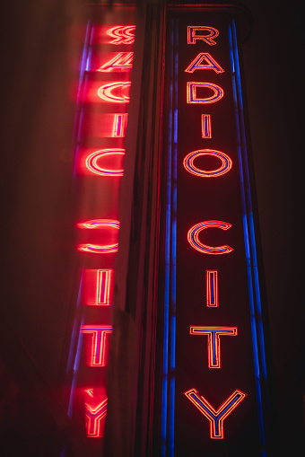 Radio City marquee reflected against a wet wall