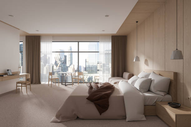 istock White and wooden bedroom interior with workplace 1844837972