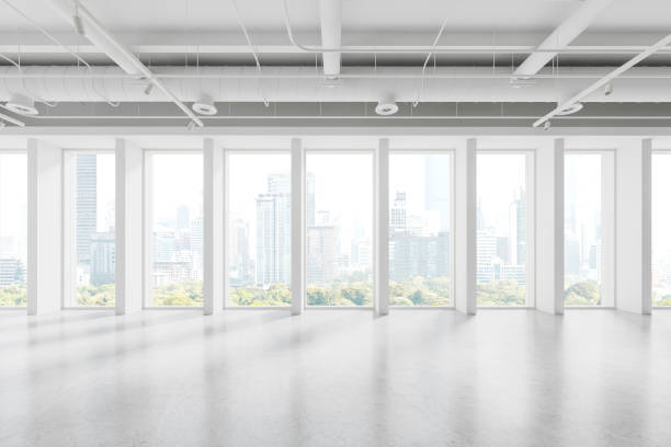 istock Stylish empty office interior with light concrete floor and panoramic window 1844847001