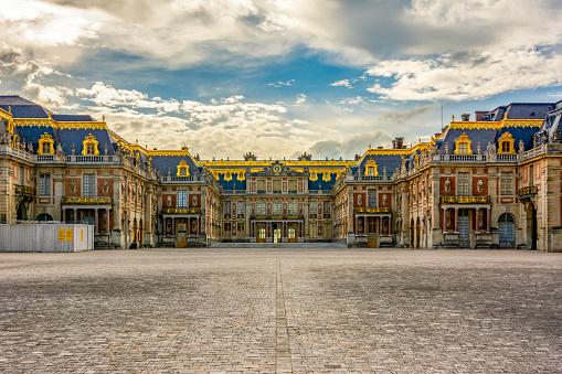 Versailles, France - May 2019: Versailles palace outside Paris at sunset