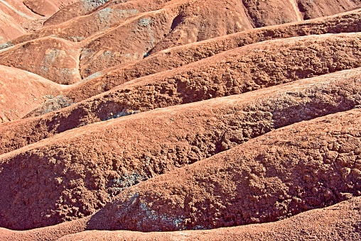 Northern Territory, Australia - August 05, 2009: Evening descends on the Uluru-Kata Tjuta National Park, in the heart of Australia's Outback. The red rock reaches a vibrant orange.