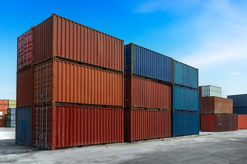 Container stacking cargo at the shipping harbor. Logistics export import Business concept.