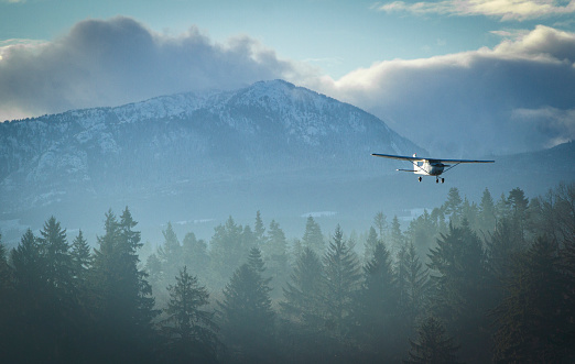 Small plane landing in the mountains