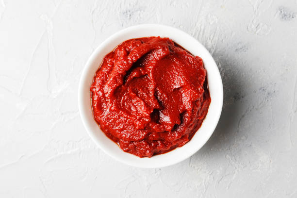 istock tomato sauce in a gravy boat on a marble background. 1844955360