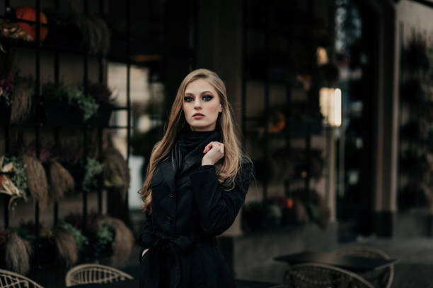 istock pretty woman in elegant black coat 1844968851