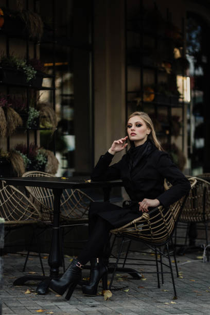 istock beautiful girl in dark coat 1844969498