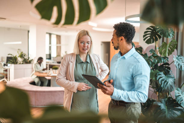 istock Expectant Employee And Colleague In Digital Workspace 1844970303