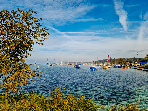 Anchored boats and yachts at marina on lake of Geneva, Switzerland.