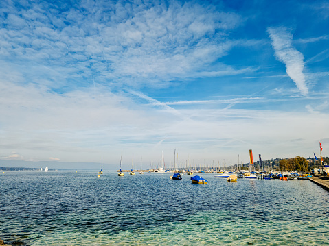 Anchored boats and yachts at marina on lake of Geneva, Switzerland.