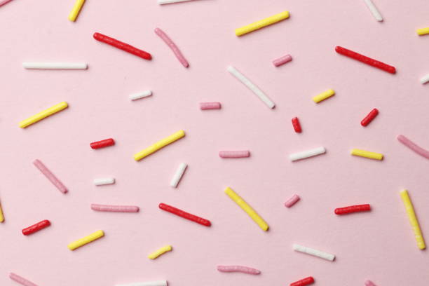 istock Colorful sprinkles on a pink background, top view with copy space. Easter holiday. Birthday celebration. 1845015264