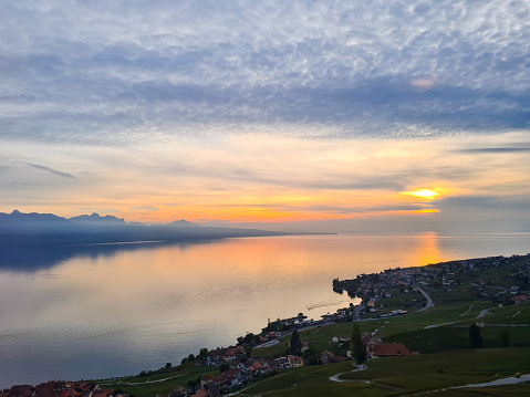 Geneva Lake View From The Train At Sunset With Town On The Shore In Switzerland