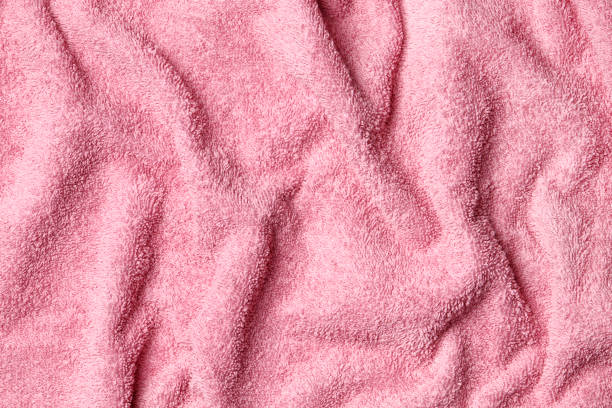 istock Soft  terry pink towel as background, top view 1845027130