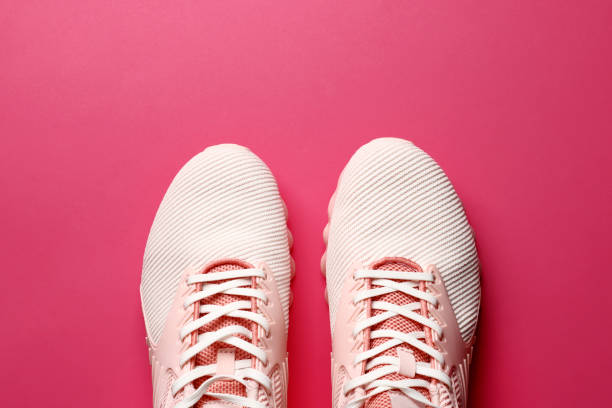 istock women's sneakers on a colored background top view. Women's shoes 1845045166