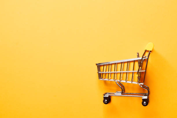 istock Shopping concept. shopping cart on a yellow background. 1845048331