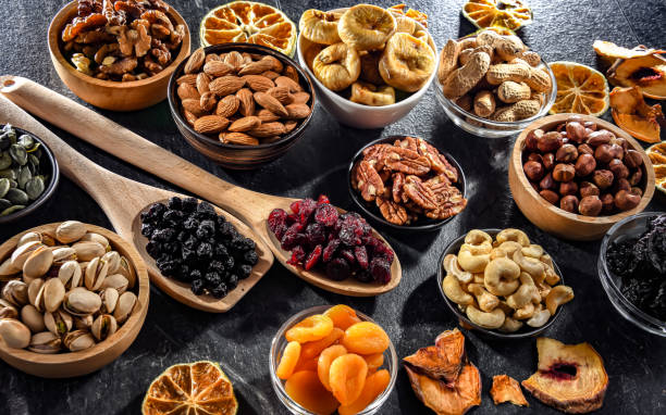 istock Composition with a variety of dried fruits and assorted nuts. 1845055179