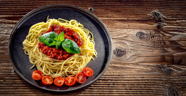 istock Composition with a plate of spaghetti bolognese 1845055717
