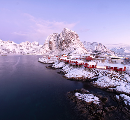 Hamnoy village in Lofoten island, covered by first snowfall in a cold morning.