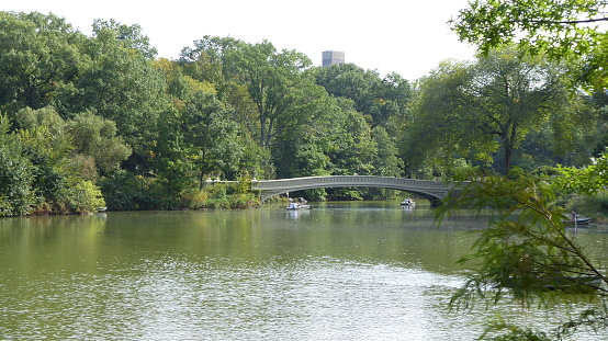 Central Park in New York on a September Tuesday, 2017. Autumn aura in the central part of the city. A place of rest and recreation for New Yorkers.Central Park in New York on a September Tuesday, 2017. Autumn aura in the central part of the city. A place of rest and recreation for New Yorkers. View of the lake in the western part of the park.