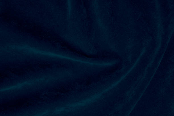 istock blue silk fabric texture used as background. denim panne fabric background of soft and smooth textile material. crushed velvet .luxury navy for velvet. 1845141711