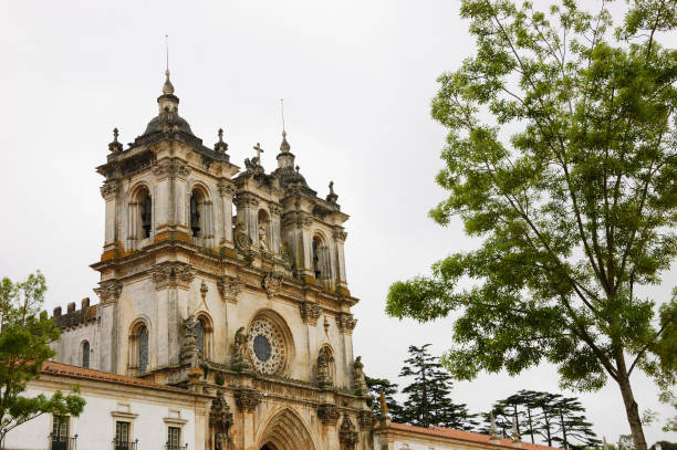 The Alcobaca Monastery. Portugal. The Alcobaca Monastery in gloomy cloudy day. Medieval Roman Catholic Monastery in Alcobaca (Portugal) is UNESCO World Heritage Site. Aged photo. alcobaca photos stock pictures, royalty-free photos & images