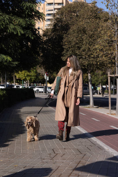 istock Young lady walking the dog 1845181104