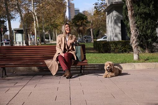 Young lady travelled to a meeting with the dog