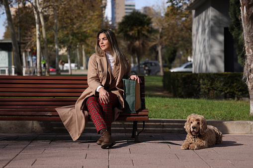 Young lady travelled to a meeting with the dog