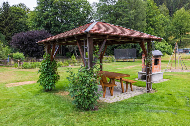 istock wooden gazebo and table on grass 1845187740